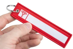 Varusteleka avaimenperä, NIMI + REMOVE BEFORE FIGHT